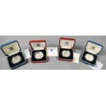 Four silver proof crowns, comprising of two The Queen Mother 90th Birthday crowns and two