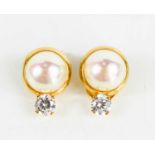 A pair of 18ct gold, simulated pearl and cubic zircona clip on earrings, marked 750, 3.1g.These