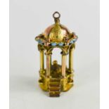 A 19th century yellow and rose gold charm, in the form of an octagonal stand with steps to the