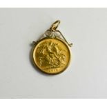 A George V 1912 gold half sovereign in a 9ct gold pendant setting, 5.4g.