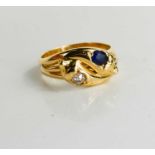 An 18ct gold, sapphire and diamond snake ring, the two snake heads set with an old cut diamond and a