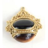 A 9ct gold swivel fob, set with three large cabochons, of tiger's eye, black onyx and agate,