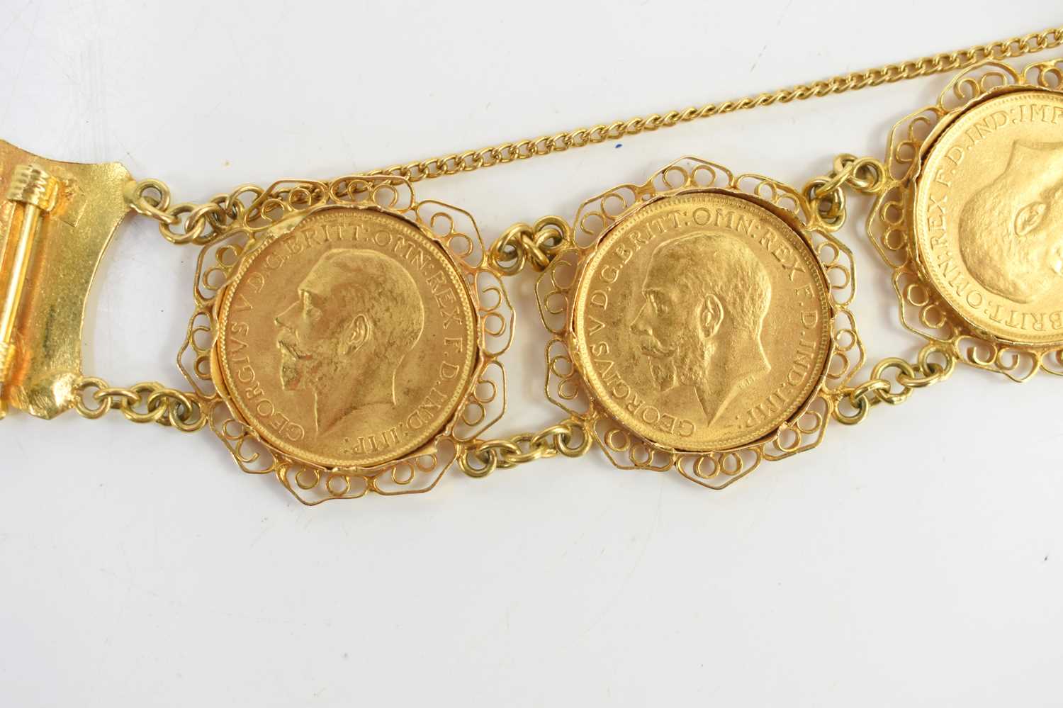 An 18ct gold sovereign bracelet set with five George V full gold sovereigns, all dated 1917 and with - Image 3 of 6