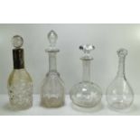 A group of four decanters, including one with a deep silver collar, Walker and Hall, Sheffield 1910,