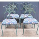 A set of four Venetian style cast iron chairs, green painted with upholstered seats.