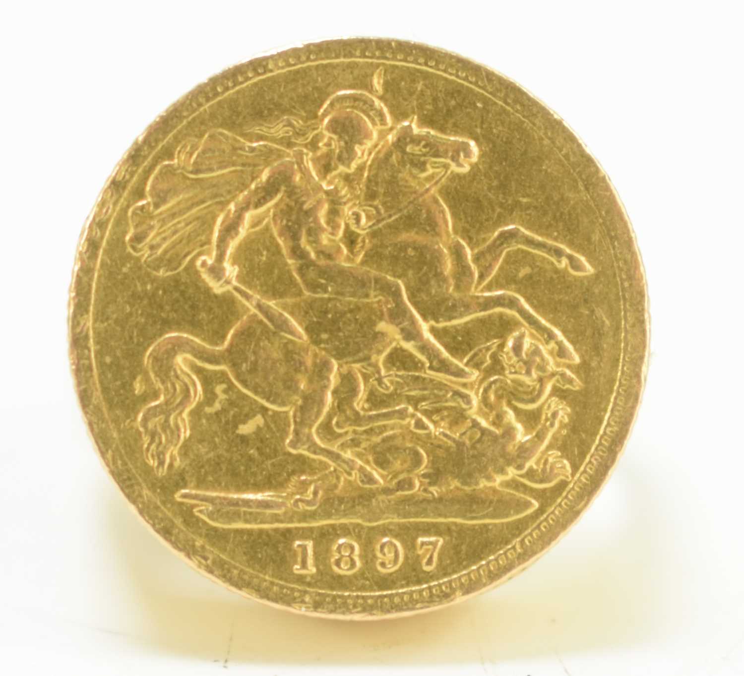 An 18ct gold ring set with a Queen Victoria gold half sovereign, dated 1897, 13.8g, size O.