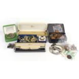A group of silver and costume jewellery including a silver bangle, two silver chains and a locket,