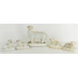 A group of four 19th century Staffordshire sheep and similar poodle.