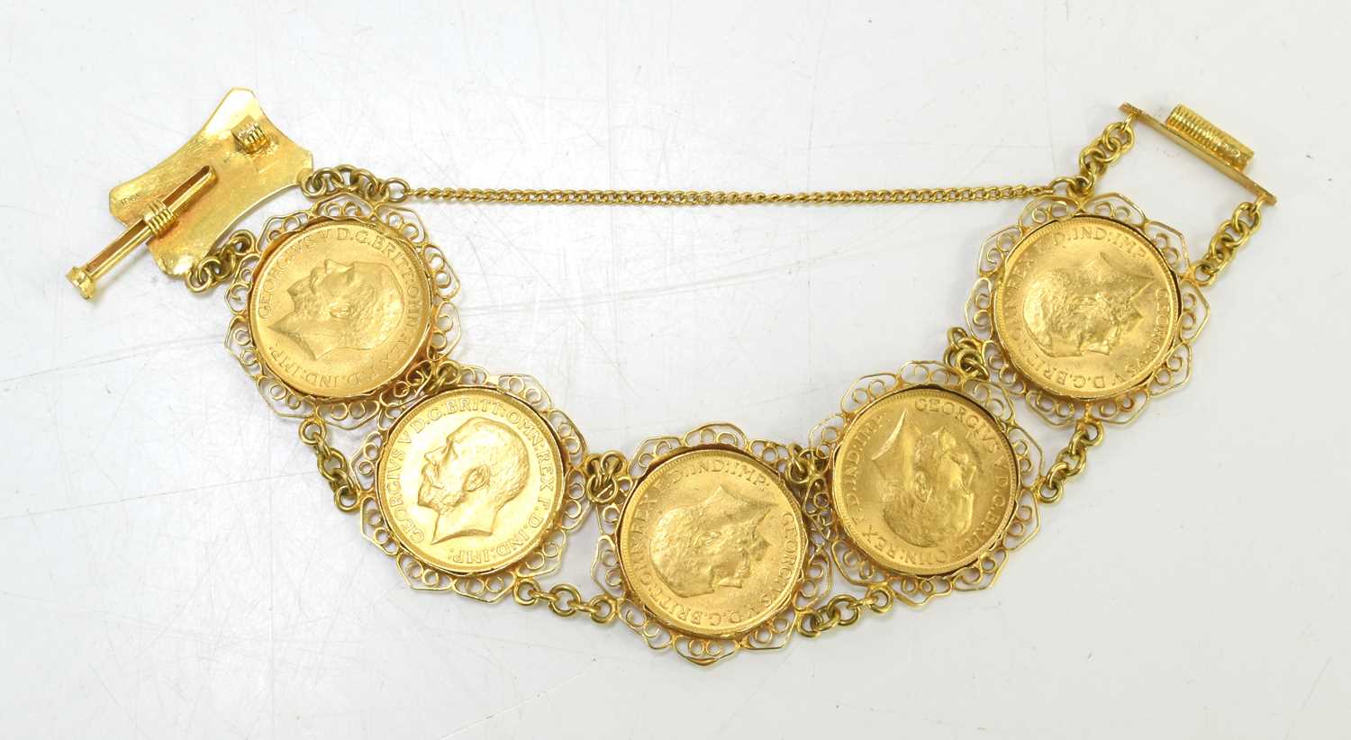An 18ct gold sovereign bracelet set with five George V full gold sovereigns, all dated 1917 and with - Image 2 of 6