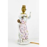 A German porcelain, possibly Wallendorfer figural candlestick, of two classical female figures,