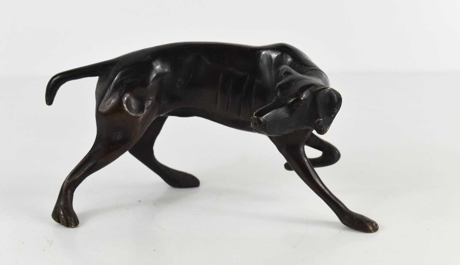 A small bronze of a pointer or gun dog, apparently unsigned, 9cm high.