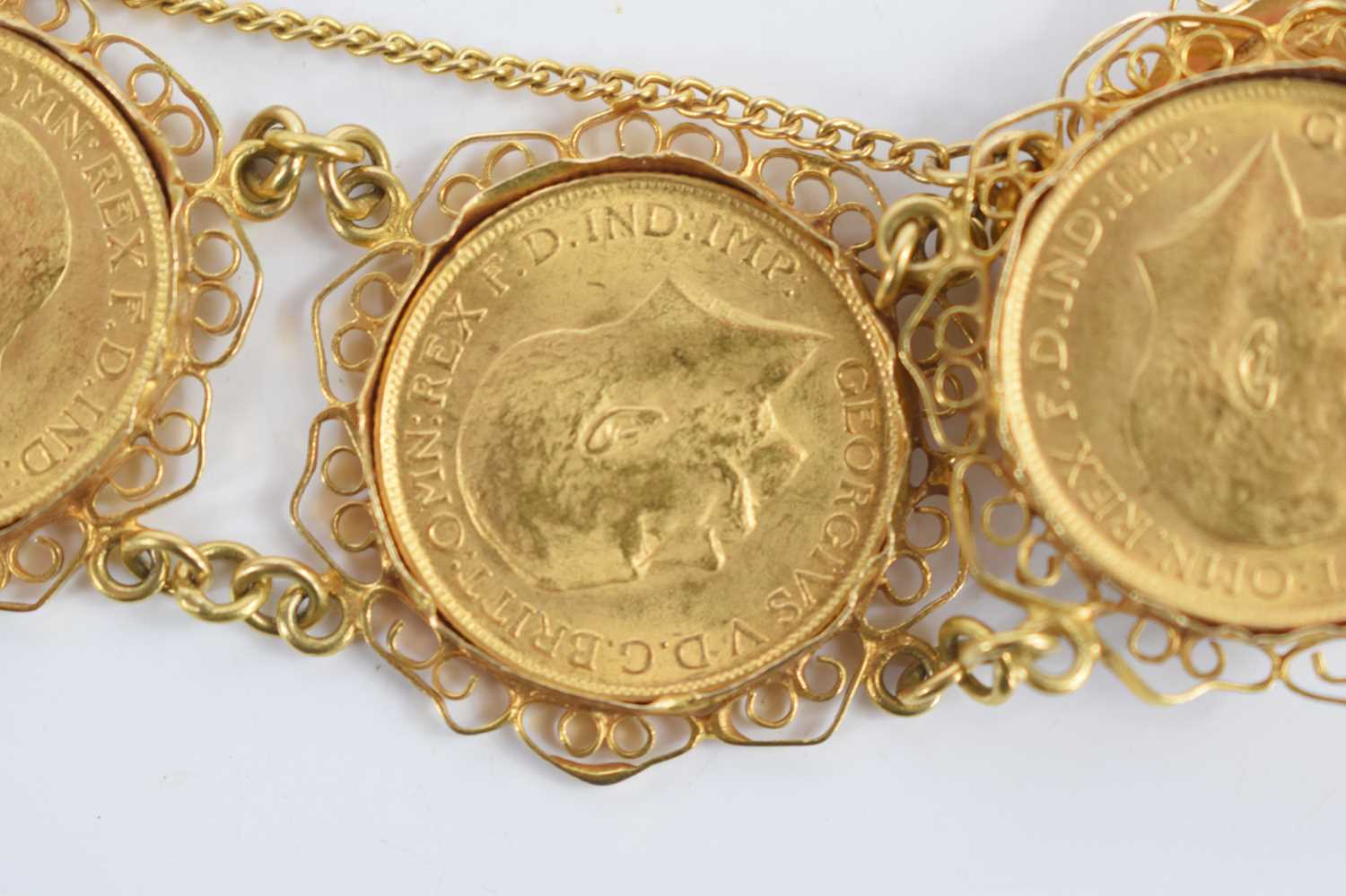 An 18ct gold sovereign bracelet set with five George V full gold sovereigns, all dated 1917 and with - Image 6 of 6