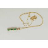 A 9ct gold, emerald and diamond set pendant with 9ct gold fine link necklace, set in bar form.