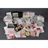 A large group of GB Queen Elizabeth II mint stamps to include various booklets from the 70s and 80s,