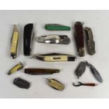A group of folding, pocket and pen knives, comprising a silver bodied folding cutlery set, (a/f