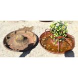 Two cast iron Mexican hat pig troughs, one with metal divisions.