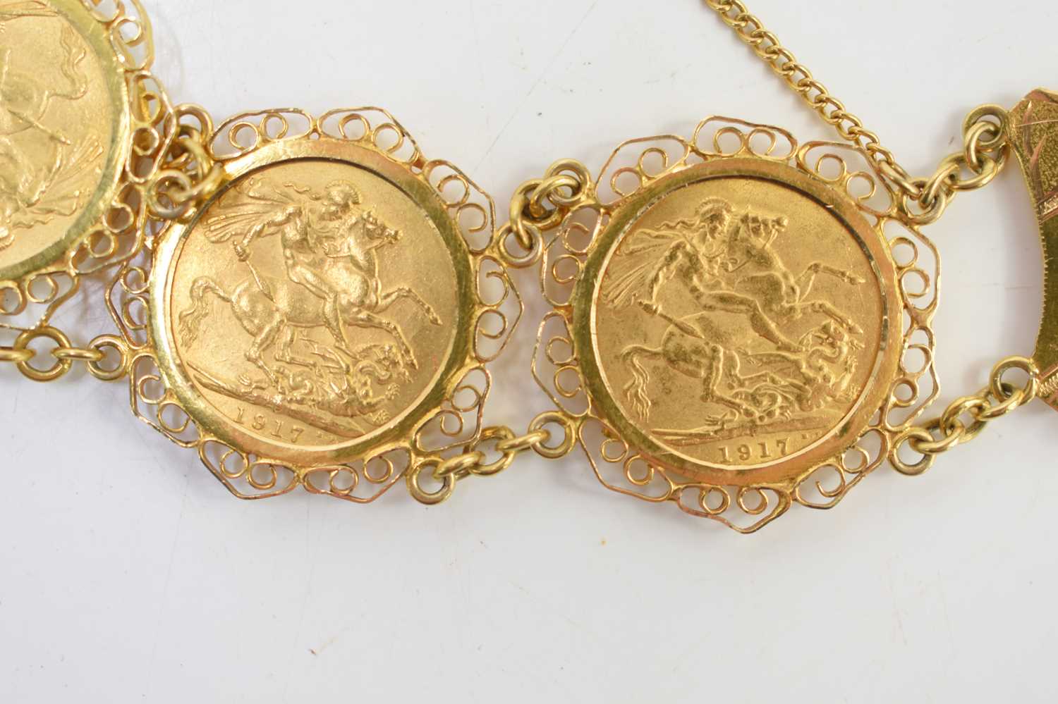 An 18ct gold sovereign bracelet set with five George V full gold sovereigns, all dated 1917 and with - Image 5 of 6