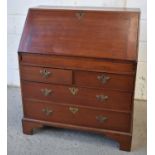 A late 18th/early 19th century mahogany bureau, the fall front enclosing a fitted interior, the