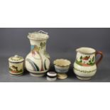 A group of Devon pottery, comprising a Honiton baluster vase in the Seaton pattern, a Torquay