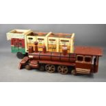 Two wooden toy vehicles of large size, comprising an Indian painted open lorry and a steam engine.