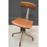 A Mid Century metal and leatherette chair.