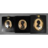 Three Victorian silhouette profile portrait miniatures, all hand painted on card, two ladies and a