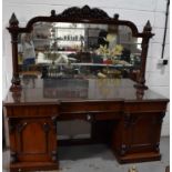 A Victorian mahogany sideboard, with mirrored back, break front base incorporating frieze drawers,
