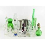 A group of glassware, to include amethyst coloured bottle and stopper, green and clear glass jars