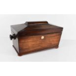 A 19th century rosewood tea caddy, of sarcophagus form, the interior fitted with two lidded