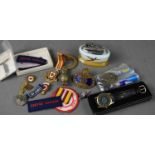 A group of collectables to include badges: CPO 70, British Red Cross, a Minton Zippo, Quartz