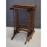 A nest of three mahogany inlaid tables, each of graduated form, with curved stretchers and feet