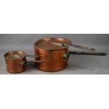 Two Victorian copper pans with covers, with iron riveted handles.