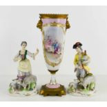 A pair of Sampson porcelain figures of a Shepherd, with bagpipes and a Shepherdess, with faux