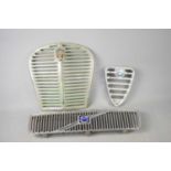 A vintage Austin chrome plated car radiator grille together with an Alfa Romeo Trefoil Grille and