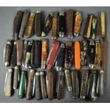 A large group of vintage pocket and pen knives including a Joseph Rogers and Sons pruning knife with