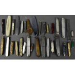 A collection of pen knives, including a miniature penknife with 1.5cm blade, the body with green