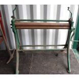 A vintage sheet metal roller on a cast iron frame, roller width 91cm.