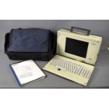 A vintage Siemans Simatic PG 740 programming device computer, with leads, manual and carry bag.