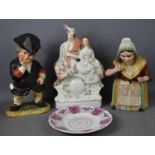 A Victorian Staffordshire figure group, together with a pair of 19th century Staffordshire Snuff