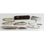 A collection of silver and collectable pocket knives, including a silver cigar and pipe smokers