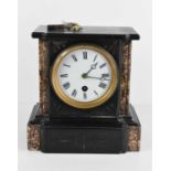 A late 19th century mantle clock in slate and marble case, the white enamel dial with Roman