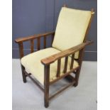 An oak armchair, with angle adjustable back.