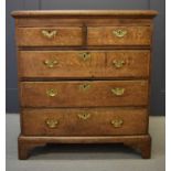 An 18th century small pale oak chest of drawers, the two short over three long graduated drawers