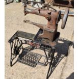 A Singer 29K53 bootmakers leather sewing machine with treadle.