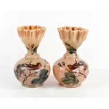 A pair of caramel milk glass vases, hand painted with birds and having frill rims.