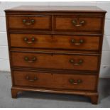 A 19th century oak chest of drawers, with mahogany crossbanded drawers, raised on bracket feet, with