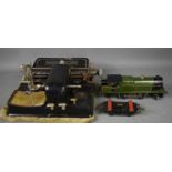 A Meccano Lt Hornby series O guage clockwork locomotive and trailer in GWR livery, numbered 2221, to