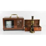 A vintage thermograph in copper case and a field microscope, boxed.