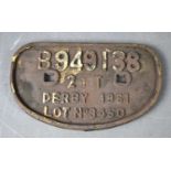 A vintage cast iron railway wagon plate, Derby 1961, number B94938, 28cm by 16.5cm.