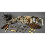 A group of collectables to include a selection of vintage postcards, vintage penknives of various